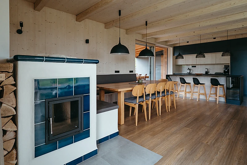 Tiled stove next to the dining table
