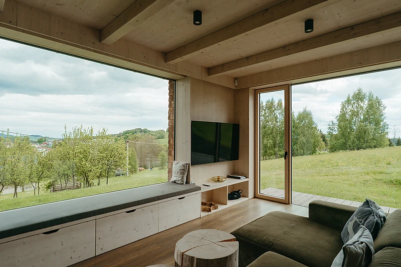 Living room with a window across the whole wall