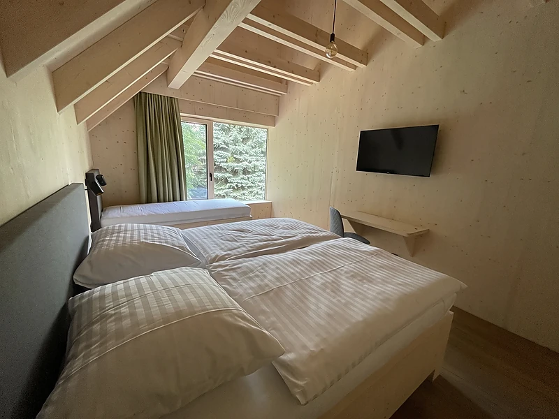 Bedroom with the bed under the window