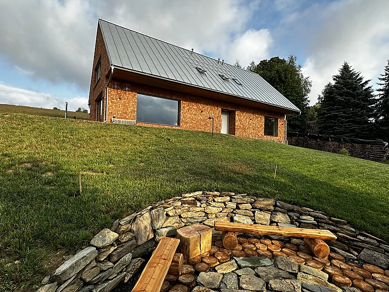 Stone fire pit set into the slope
