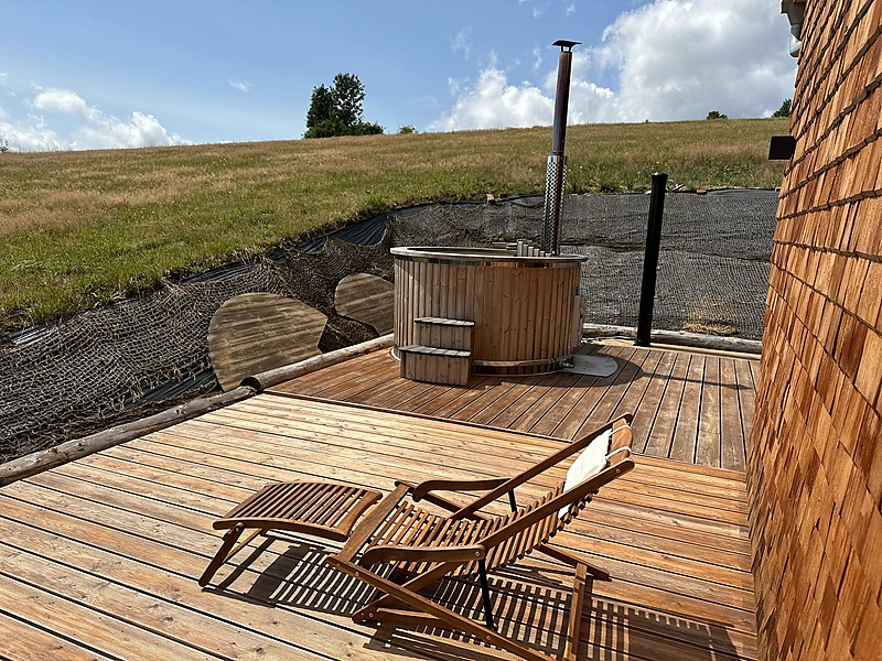 Terrace with the hot tub and a view over the valley