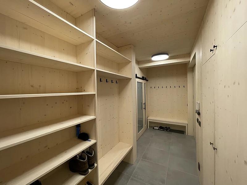 Shelves for boots and ski boots in the entrance hall